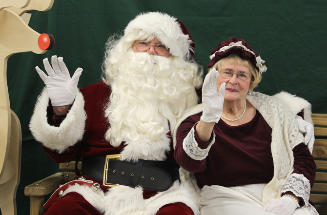 Santa and Mrs. Claus waving